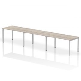 Evolve Plus 1400mm Single Row 3 Person Bench Desk Grey Oak Top Silver Frame